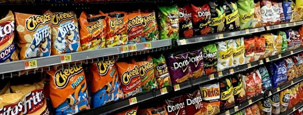 Tortilla and potato chips on a store rack
