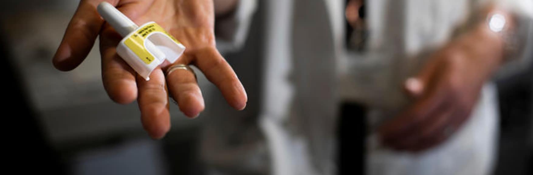 Medical professional holding Narcan