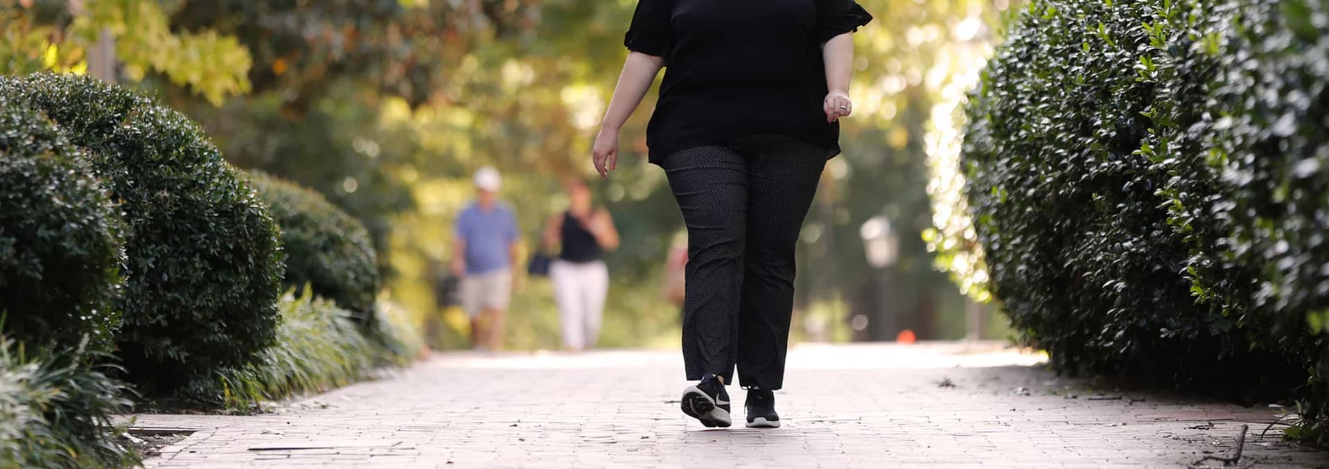 Adults walking outdoors
