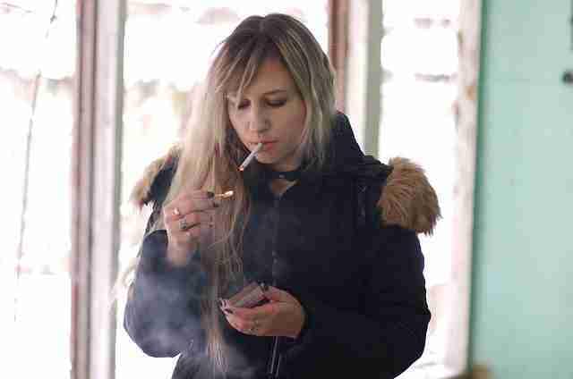 young woman smoking a cigarette