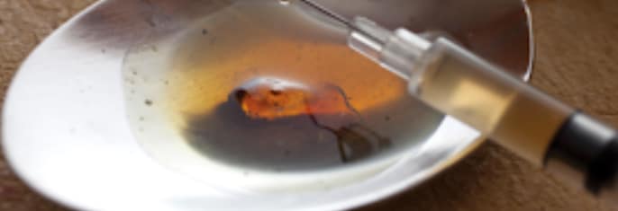 needle and spoon for illicit drug injection