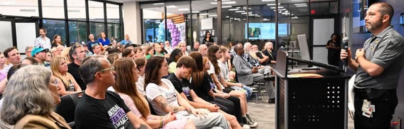 a crowd listening to a speaker