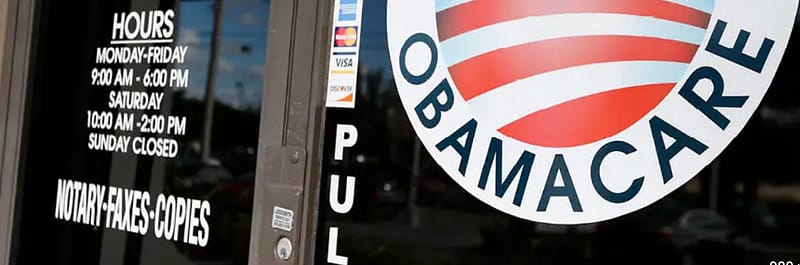 OBAMACARE logo on a business window