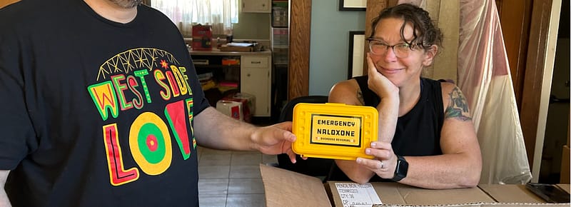Community ourtreach workers holding a Narcan kit