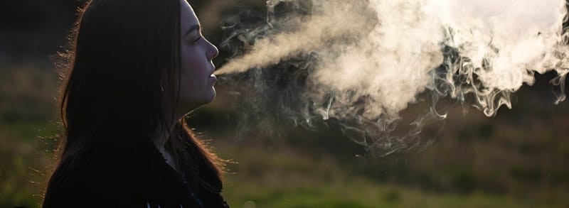 image of a girl vaping