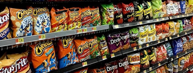 Tortilla and potato chips on a store rack