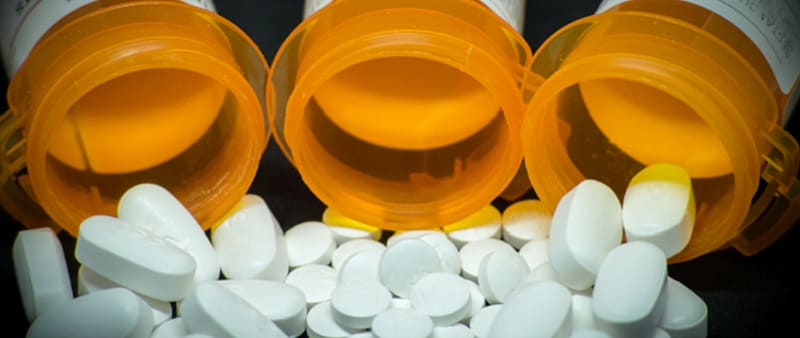 Pills spilling from bottles
