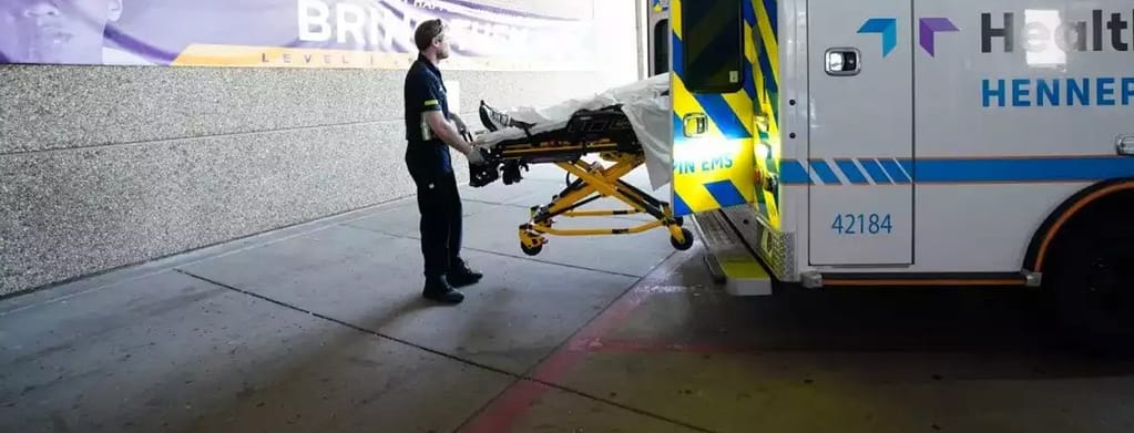 Body being taken out of an ambulance
