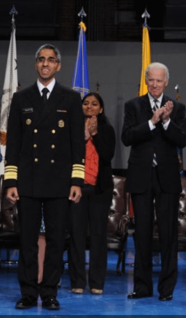 Joe Biden standing next to Vivek Murthy