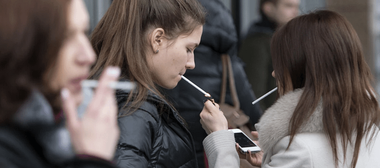 teenagers smoking cigarettes