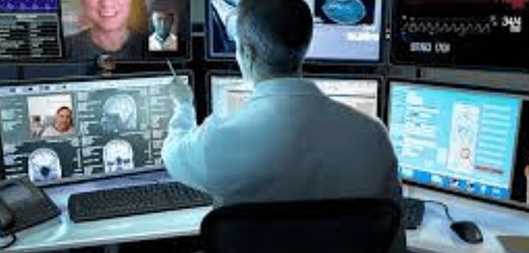 medical professional viewing computer screens