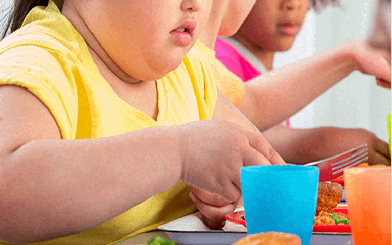 obese child eating