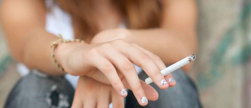Teen girl with cigarette