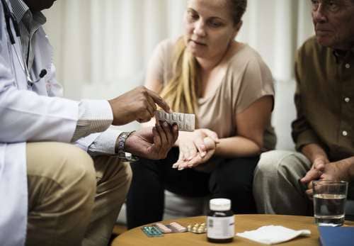 Doctor with patient discussing medication