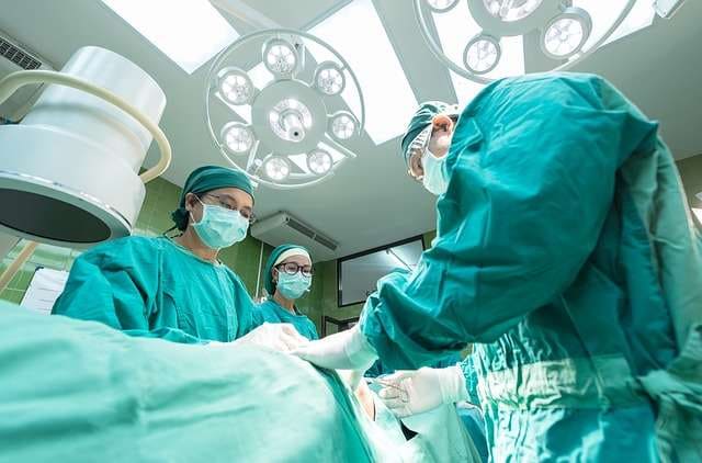 surgeons performing surgery