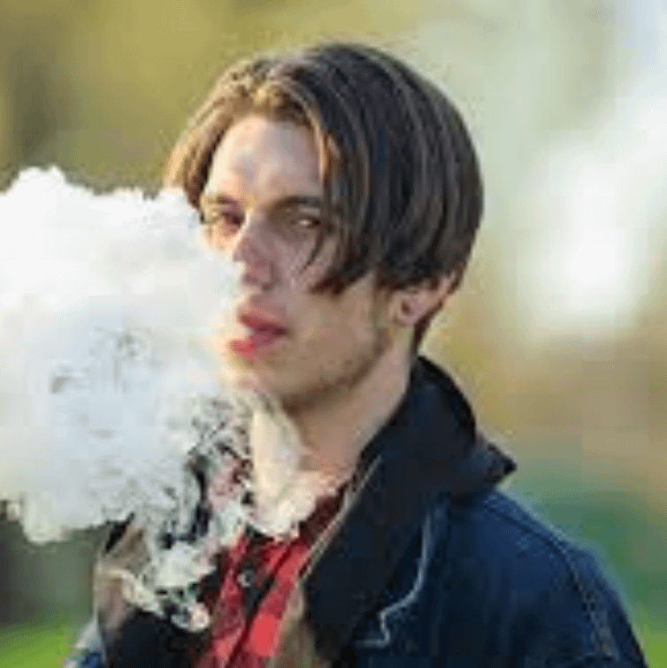 teenaged boy vaping