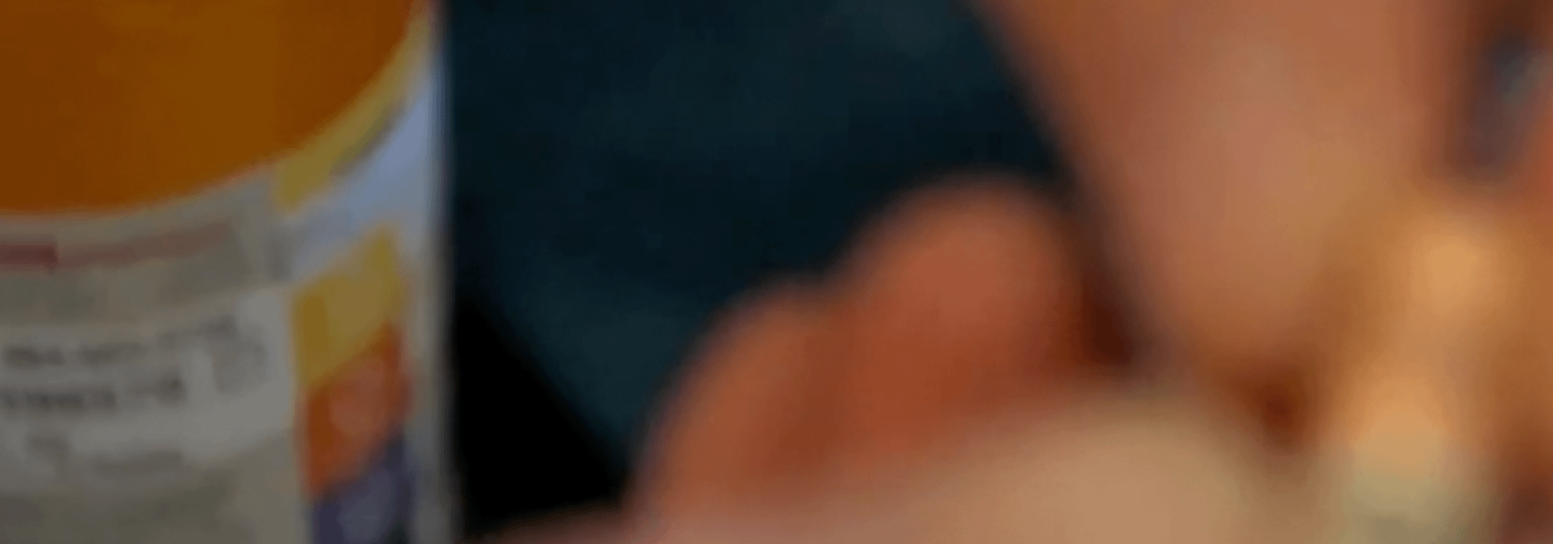 fingers holding pill