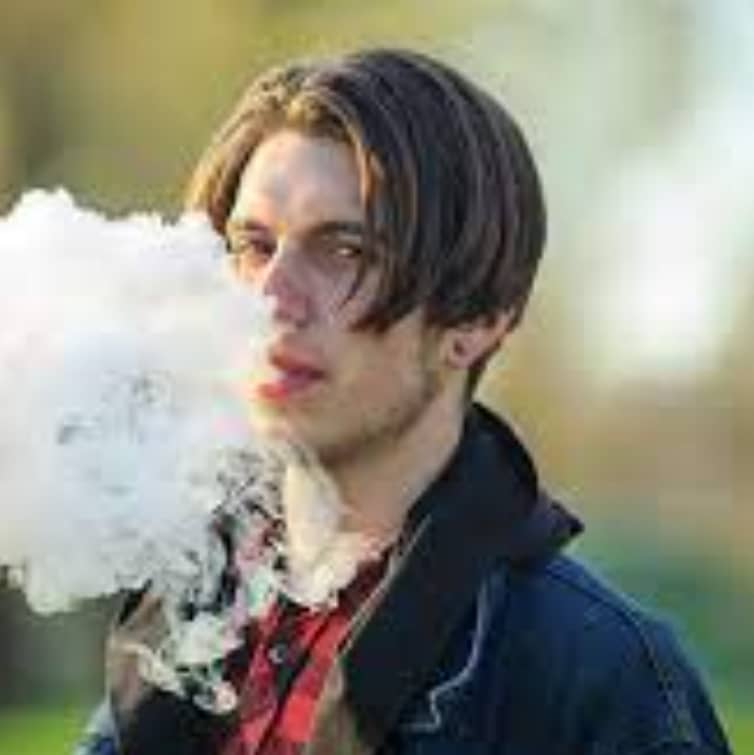 teenaged boy vaping